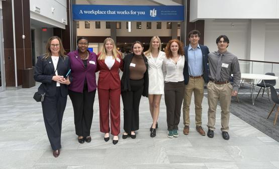  Two members of the Career Services team and six Russ College students pose for a photo inside the Nationwide Insurance headquarters building 
