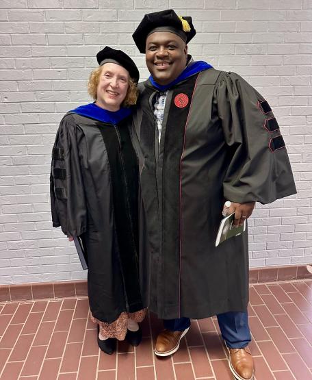 Two OHIO leaders in regalia pose for a photo at the Graduation Recognition Ceremony at OHIO Zanesville