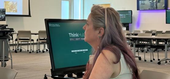 Dr. Kat Marriott listens to a presentation at the ITDI on-campus ceremony on May 15