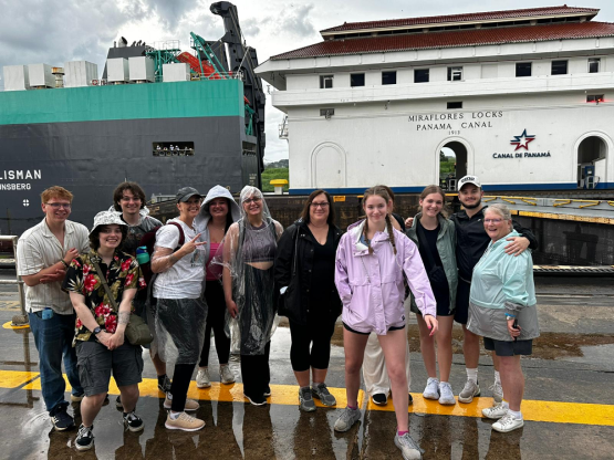  OHIO students and faculty stand in front of a building at the Panama Canal 