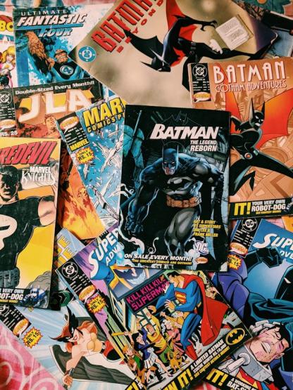 An image that shows multiple comic book covers piled on top of each other