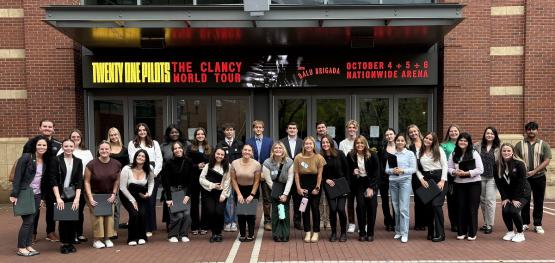OHIO students in the SHRM Chapter pose for a group photo in front of a building in Columbus