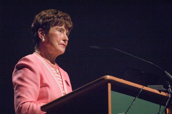 Jeanette Grasselli Brown stands at a podium during a Frontiers in Science lecture