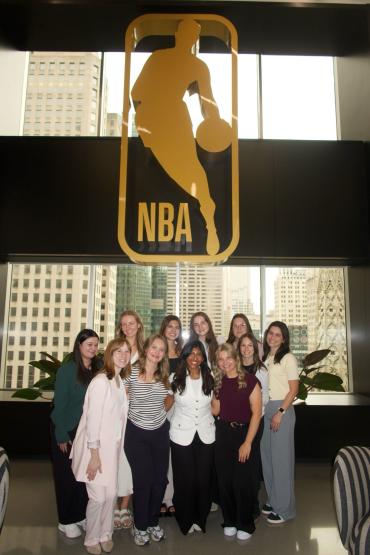 11 female college students pose at the NBA offices in New York City