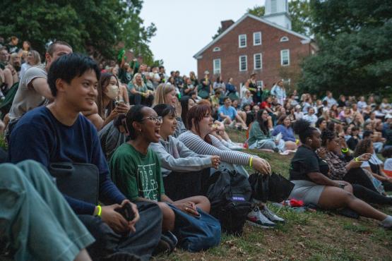 OHIO students sit on the hillside next to Cutler Hall for the 2024 Yell Like Hell Pep Rally