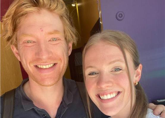 Two people pose for a selfie