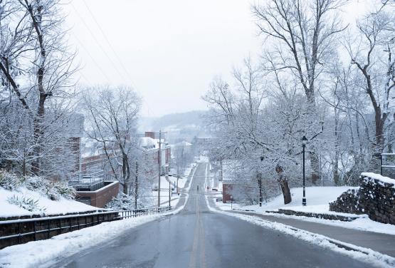 Snow covers the trees and buildings on OHIO's campus from this view from the top of Jeff Hill