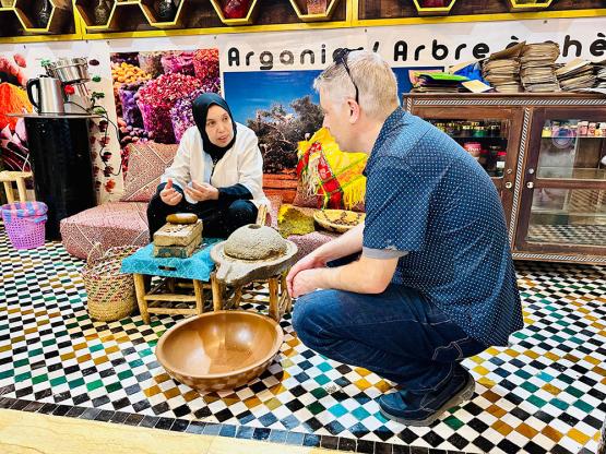 Jeff Kuhn teaches in Morrocco in a public market