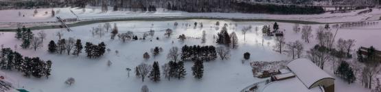 An aerial view of OHIO's Athens campus covered in snow