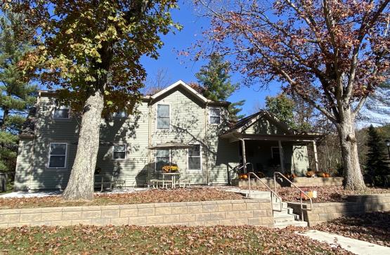 The outside of the Serenity Grove facility is shown on day in Fall