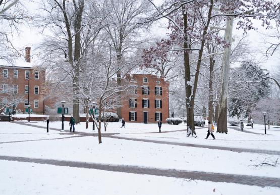 Students walk across the snow-covered College Green at Ohio University.