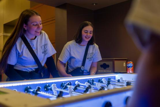 OHIO siblings plays foosball during the GLOHIO event in Baker University Center in 2025