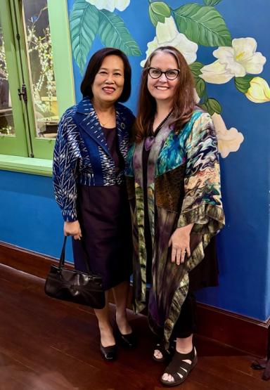 Mrs. Korkan Sangiompongsa and Dean Roxanne Schroeder-Arce are shown at an alumni event in Thailand