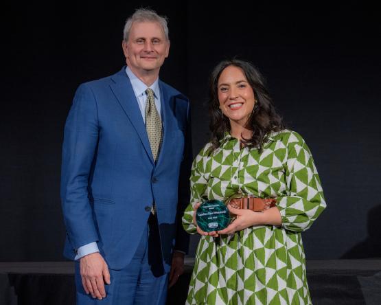 Provost Don Leo and Candice Rios Wenmoth stand together with the University Professor Award.
