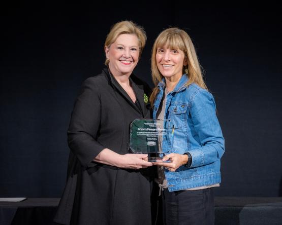 President Gonzalez and Christi Camper Moore hold the Presidential Teacher Award