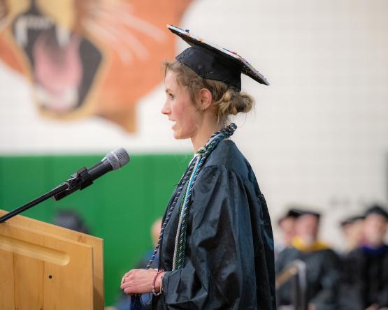 Destiny Kemmerling presents her remarks while standing at the podium during the Graduation Recognition Ceremony