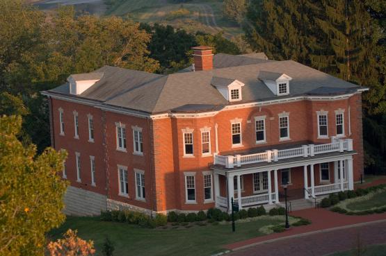 An aerial image of the Voinovich School building