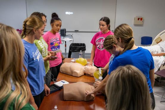 students participate in CPR training