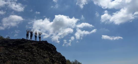 Photo of students spelling OHIO on top of mountain.