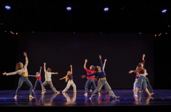 OHIO students dance on stage as part of the project