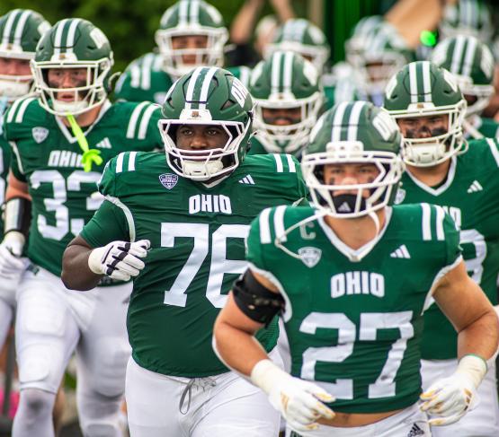 OHIO Football players run onto Frank Solich Field in Peden Stadium
