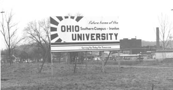 A black and white historic photo that of a sign that says "Future Home of Ohio University Southern"