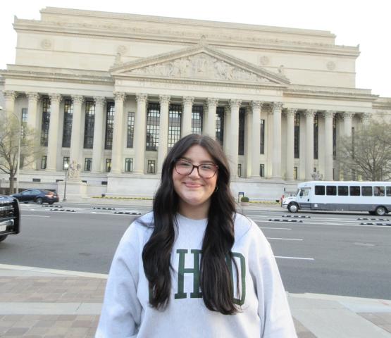 Katie Raines stands in front  of a government building in Washington, D.C.