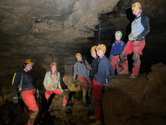 OHIO students stand together in a cave