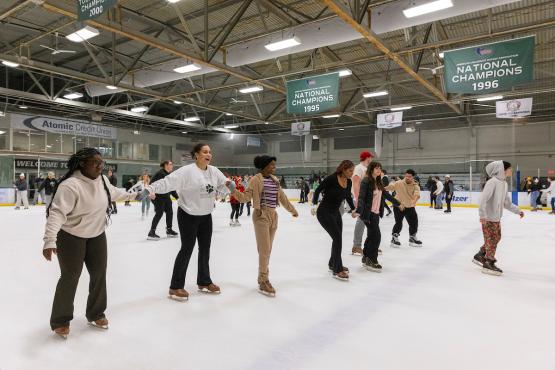 OHIO students skate on the ice in Bird Arena