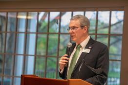 Russ College Dean Patrick Fox speaks into a microphone at a podium