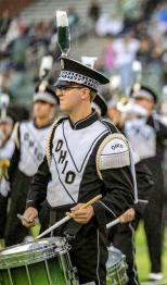 Marching 110 band member plays instrument