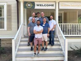 Seven Honors Tutorial College alumni pose at a college reunion