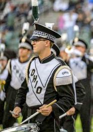 Marching 110 band member plays instrument