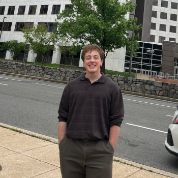 Student poses at NRC internship site