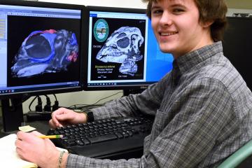 OHIO student Daniel Dunfee studying skull growth in the Jurassic ornithopod dinosaur using microCT scanning. 