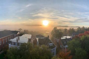 A sunrise over the hills that circle Athens campus South Green
