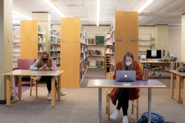 Students work in Alden library isolated from each other