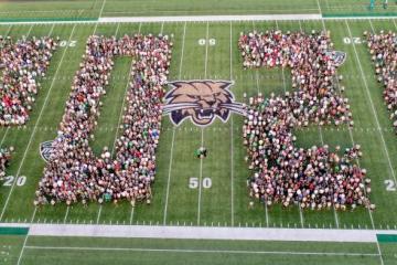 Students at Peden stadium spell out 2021