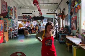 Kirby Bowman ties her apron at Passion Works Studios