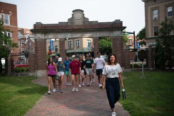 A photo of a campus tour on the College Green