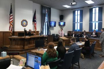 A photo from the Summer Law and Trial Institute holding a mock trial in an Athens courtroom in 2019.