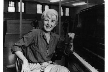 Betty Walberg in the studio at Ohio University with dancers behind her