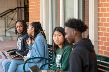 Students gather outside Bentley Hall.