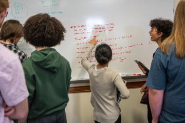 Computer science students engage in group work