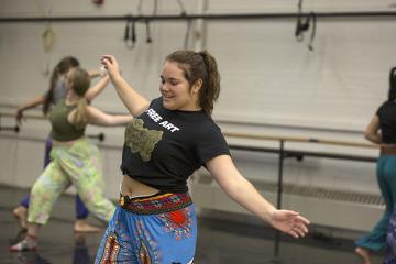 Student gestures in a dance class in Putnam Hall