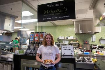 Adler Matey with a gluten-free sandwich at Margaret's at the District on West Green.