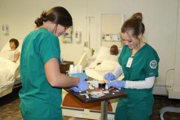 BSN students administering injections in a new lab space