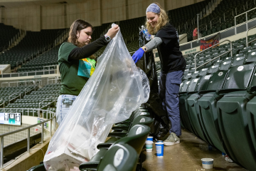 OHIO students are shown gathering trash as part of the GameDay Challenge