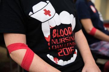 Student donating blood during the blood drive