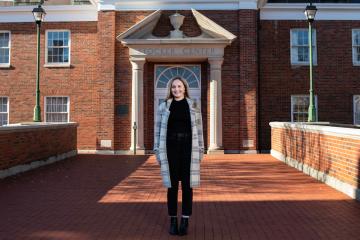 Cassidy Serger in front of Stocker Hall